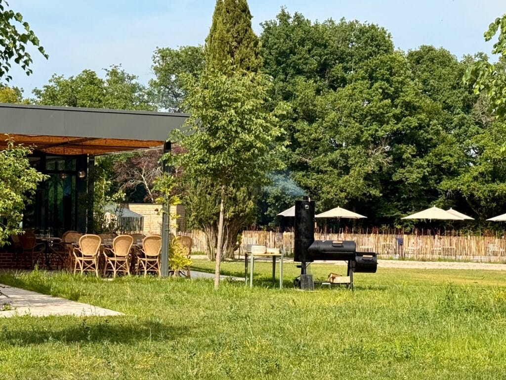 The barbecue set up in the park facing the terrace during Sunday brunch at Le Cyprès Chauve in Sologne
